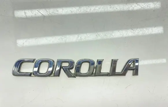 Toyota Corolla E120 E130 Manufacturers badge/model letters 