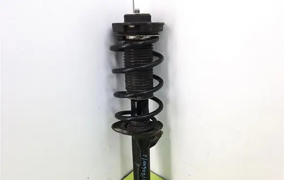 Volkswagen PASSAT B6 Front shock absorber with coil spring MGA5712