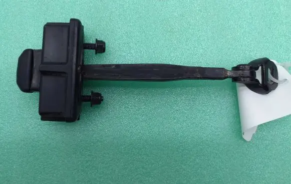 Rear door check strap stopper