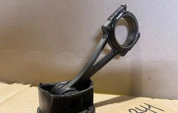 Opel Tigra B Piston with connecting rod 73L82A2