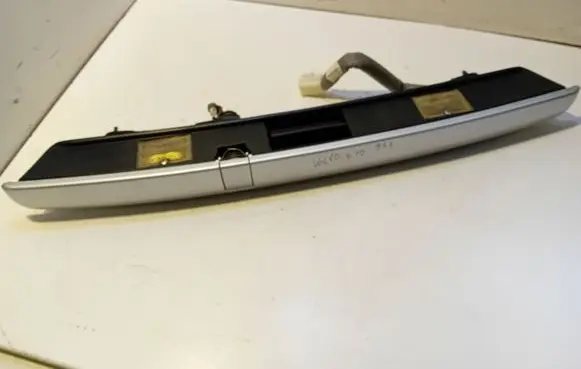 Trunk door license plate light bar