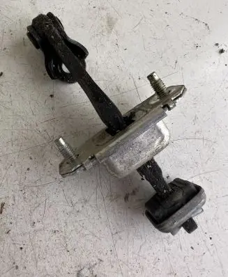 Front door check strap stopper