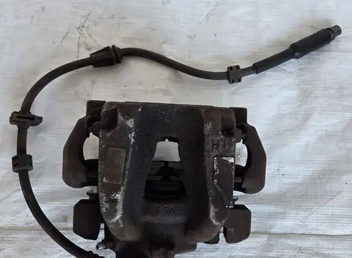 Opel Combo E Front brake caliper 
