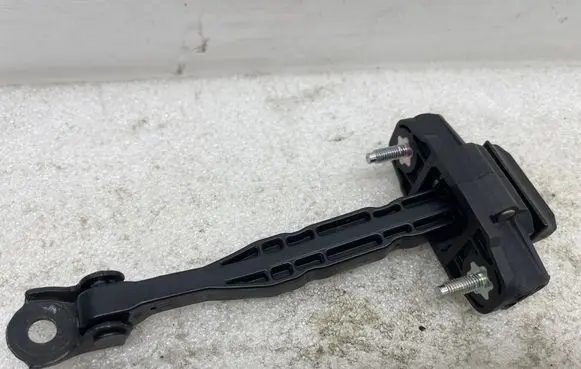 Front door check strap stopper
