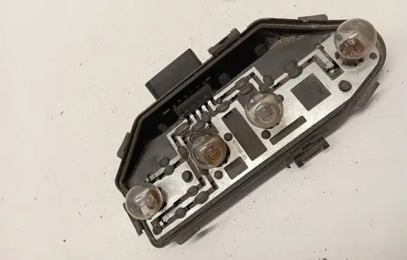 Tail light bulb cover holder