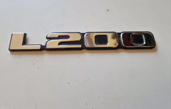 Mitsubishi L200 Front door emblem/model letters 