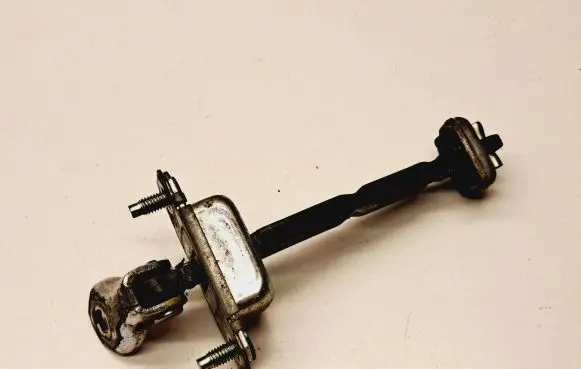 Subaru Outback Front door check strap stopper