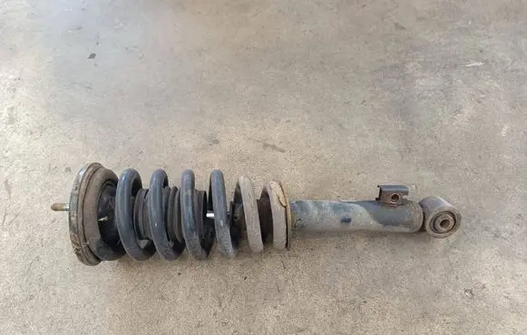 Mitsubishi L200 Front shock absorber with coil spring