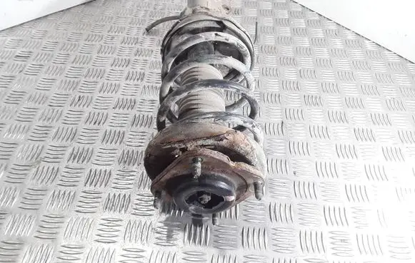 Mazda 323 F Front shock absorber with coil spring