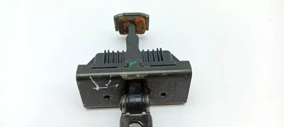 Front door check strap stopper