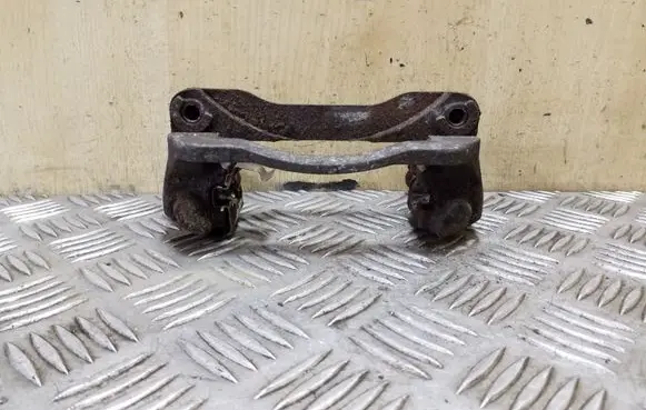 Subaru Legacy Brake caliper pad carrier rear 