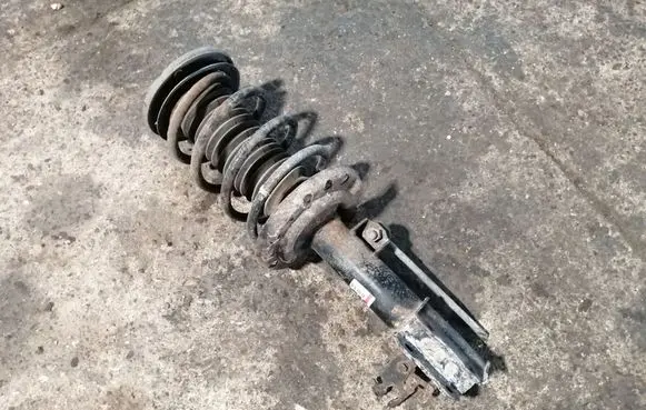 Cadillac BLS Front shock absorber with coil spring 12776190 824904003780