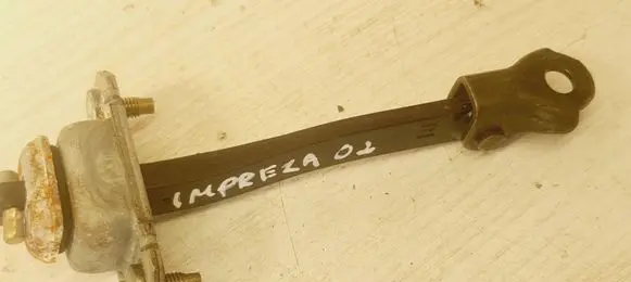 Subaru Impreza II Rear door check strap stopper