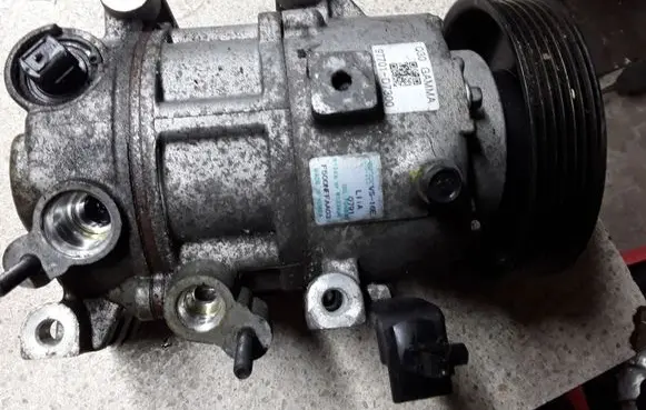 KIA Sportage Air conditioning (A/C) compressor (pump) 97701D7300