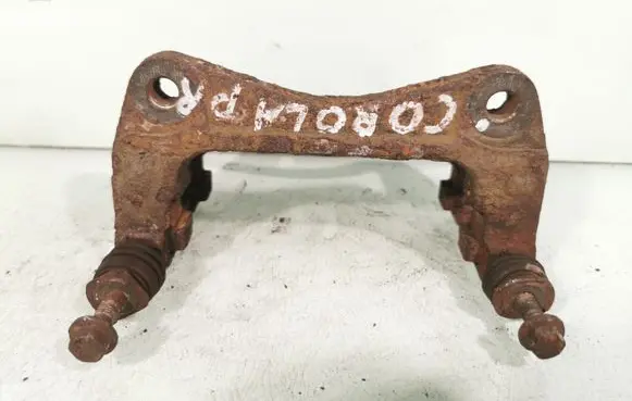 Toyota Corolla E120 E130 Front Brake Caliper Pad/Carrier 