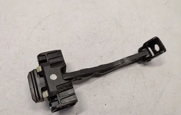 Front door check strap stopper