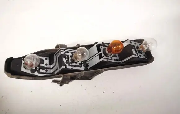 Tail light bulb cover holder