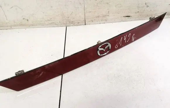 Mazda 626 Trunk door license plate light bar K2443
