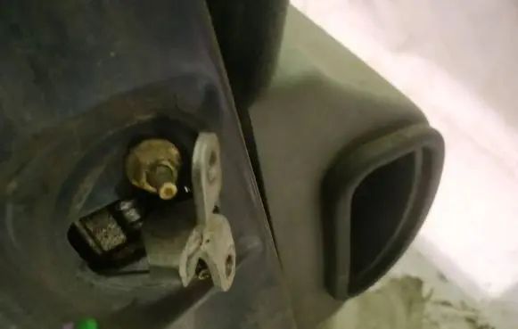 Front door check strap stopper
