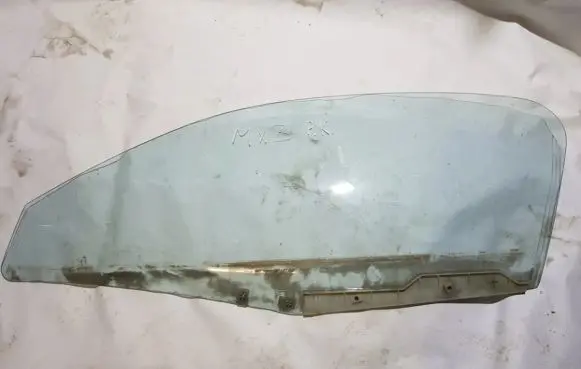 Mazda MX-3 Front door window glass four-door
