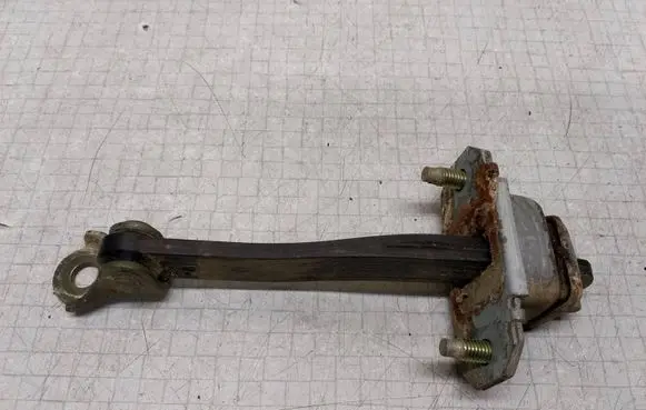 Subaru Legacy Rear door check strap stopper