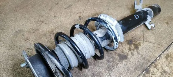 Front shock absorber with coil spring