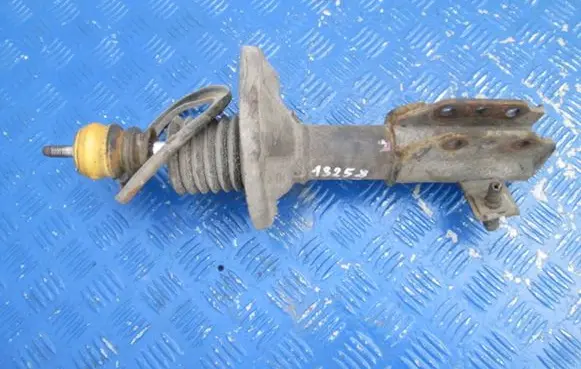 Mazda 323 F Front shock absorber with coil spring
