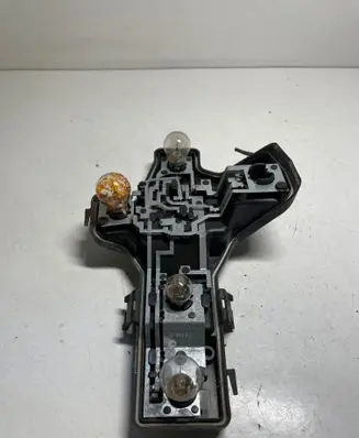 Tail light bulb cover holder