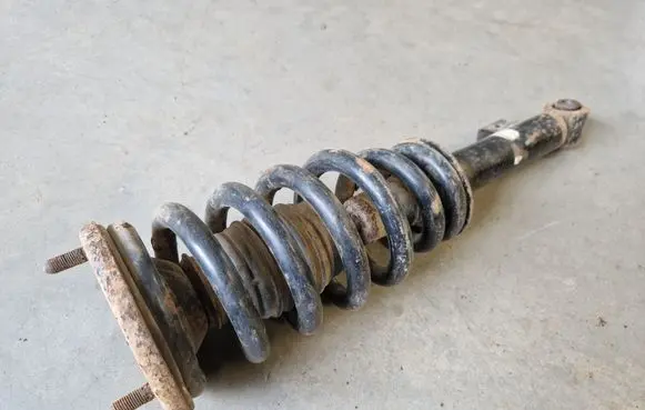 Mitsubishi L200 Front shock absorber with coil spring MR992321
