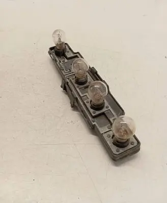Tail light bulb cover holder