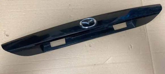 Mazda 626 Trunk door license plate light bar GG3E50810