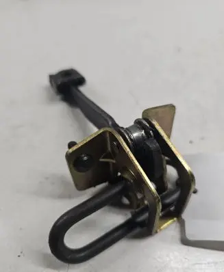 Front door check strap stopper