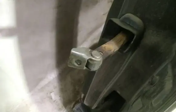 Rear door check strap stopper