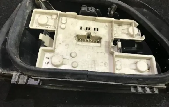 Renault Clio I Tail light bulb cover holder