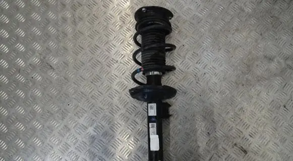 Volkswagen Golf VII Front shock absorber with coil spring 5Q0413023FH
