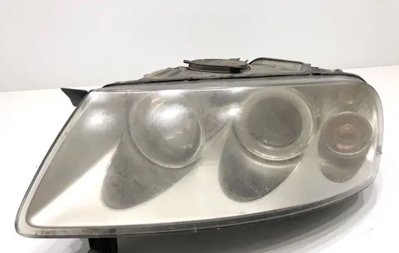Volkswagen Touareg I Headlight/headlamp 7L6941015CE
