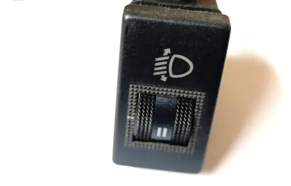 Headlight level height control switch