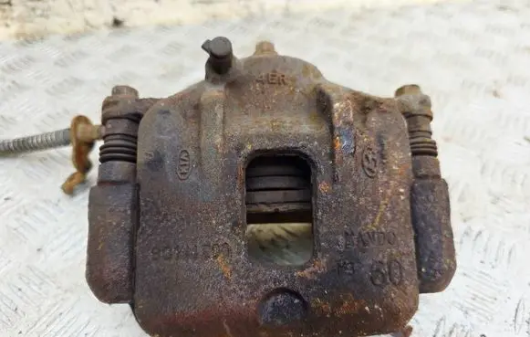 KIA Carens III Front brake caliper 