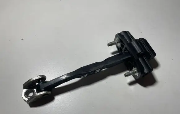 Front door check strap stopper