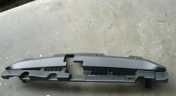 Engine bonnet/hood lock trim molding