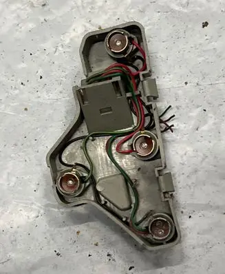 Mazda 121 Tail light bulb cover holder 22061364