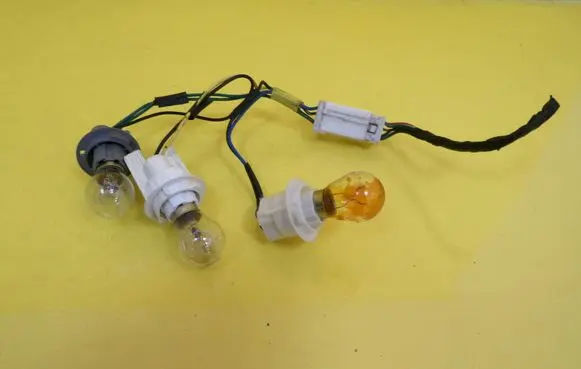 Hyundai Coupe Tail light bulb cover holder