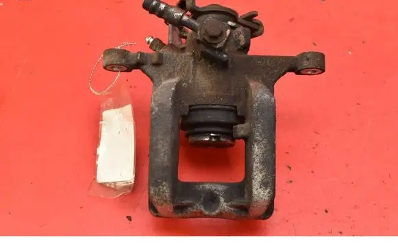 Opel Astra J Rear brake caliper 