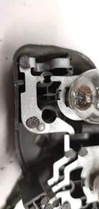 Tail light bulb cover holder