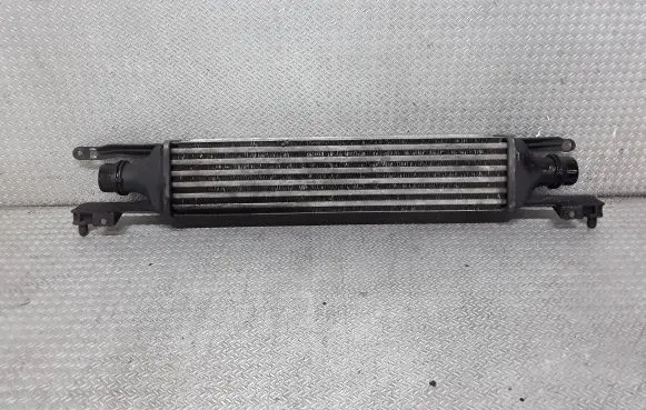 Opel Corsa D Intercooler radiator 55702194