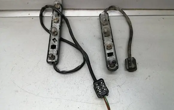 Tail light bulb cover holder