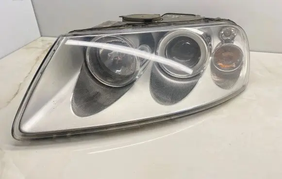 Volkswagen Touareg I Headlight/headlamp 7L6941015BJ 89307871 20A5302