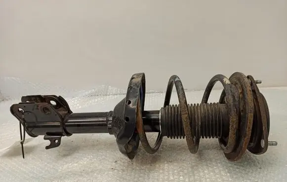 Subaru Legacy Front shock absorber with coil spring 334373