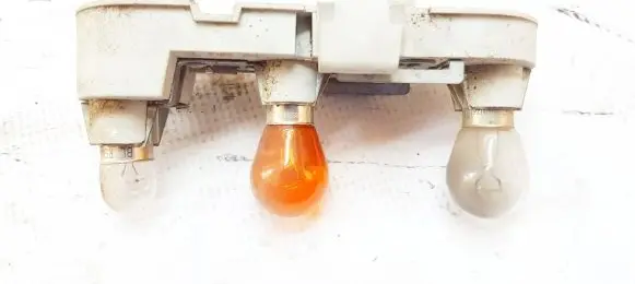 Tail light bulb cover holder