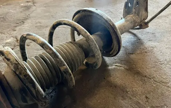Subaru Outback Front shock absorber with coil spring